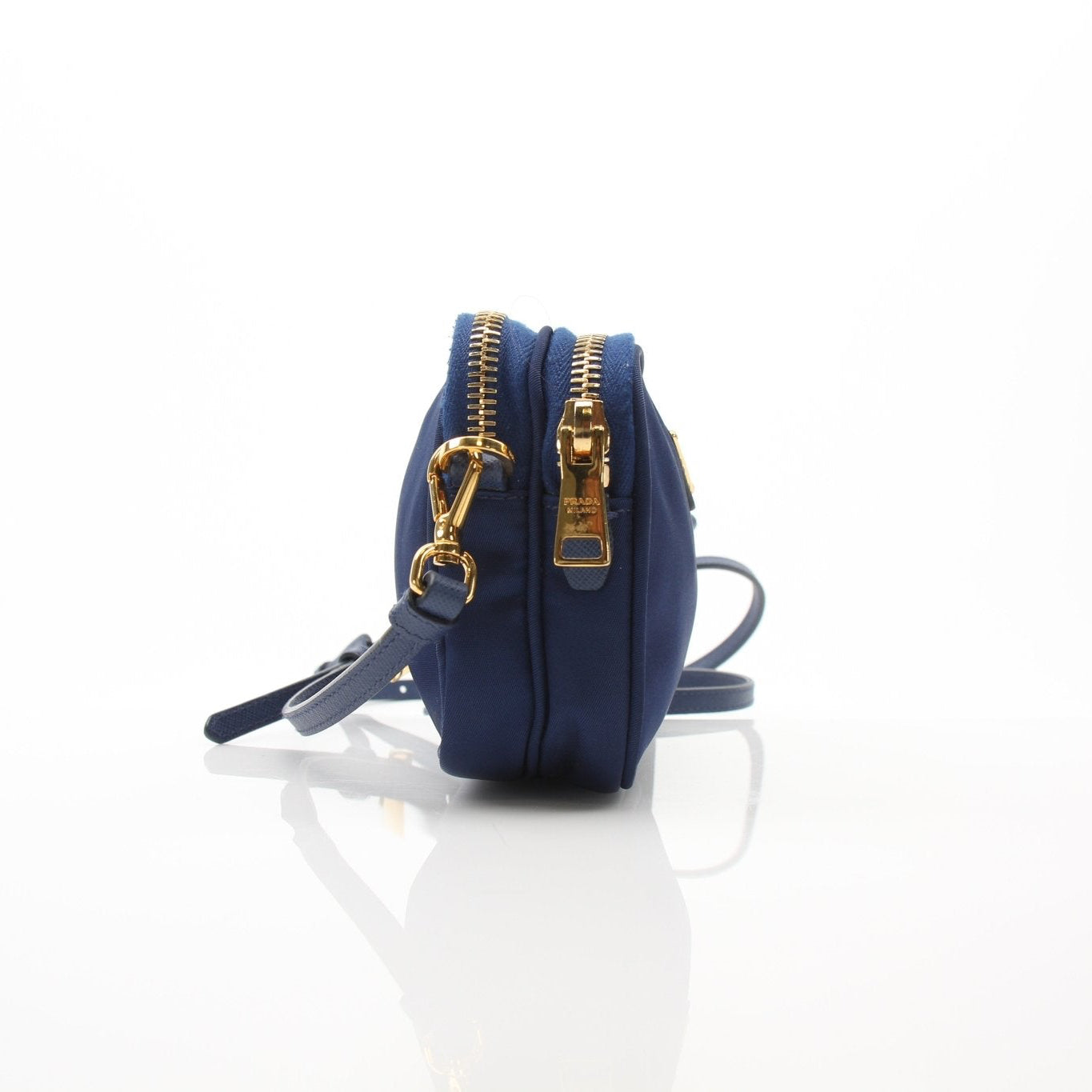 Prada blue nylon crossbody handbag with adjustable strap and gold-tone hardware, stylish and lightweight for everyday use.