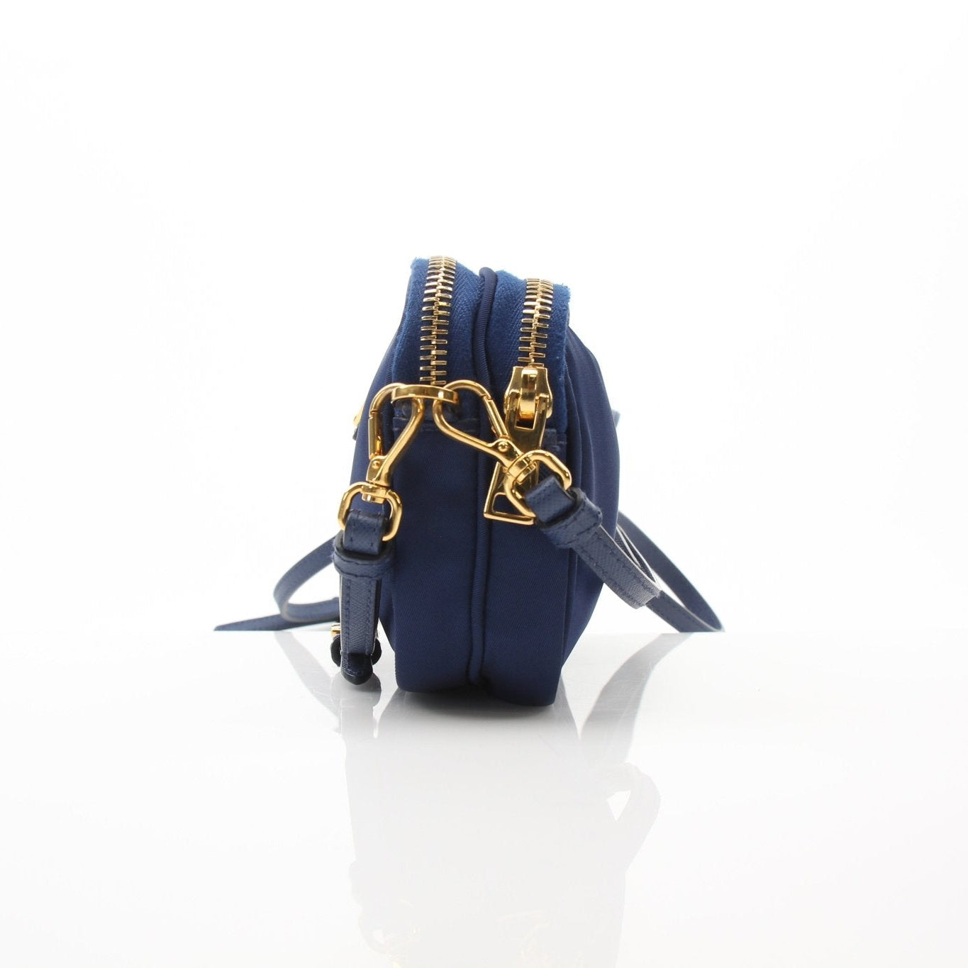 Prada blue nylon crossbody handbag with adjustable strap and gold hardware, casual and stylish for everyday use.