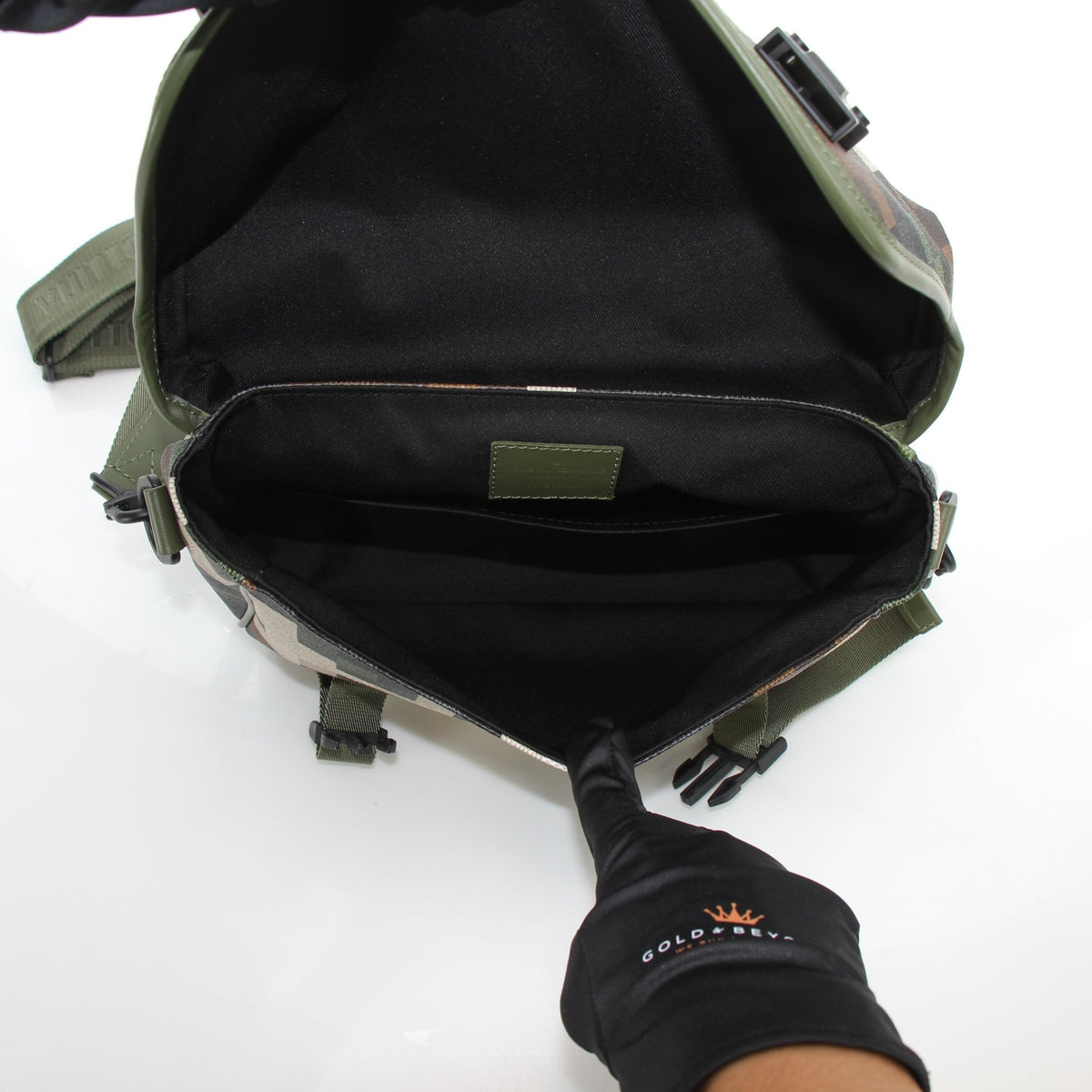 Louis Vuitton green Damoflage LV Trail messenger handbag with adjustable strap and gold accents, front flap closure.