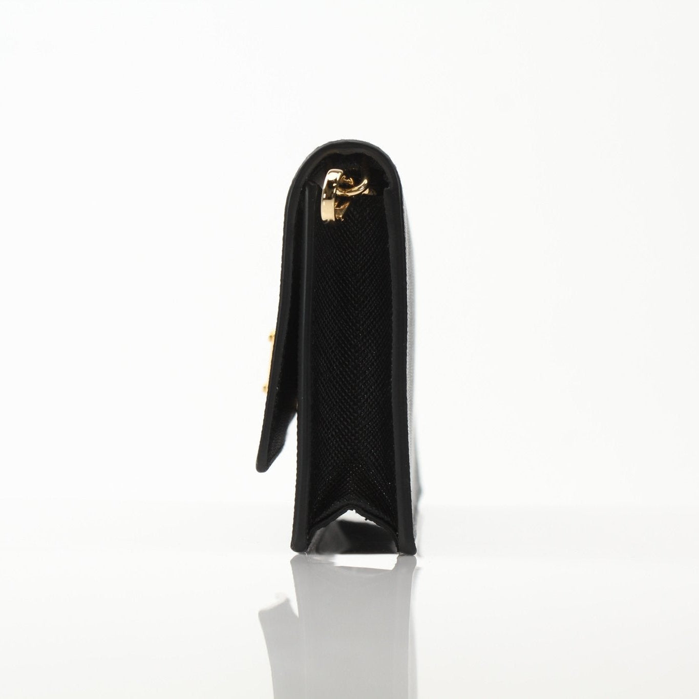 Gold & Beyond Prada mini crossbody handbag with sleek design and adjustable strap, perfect for stylish everyday use.