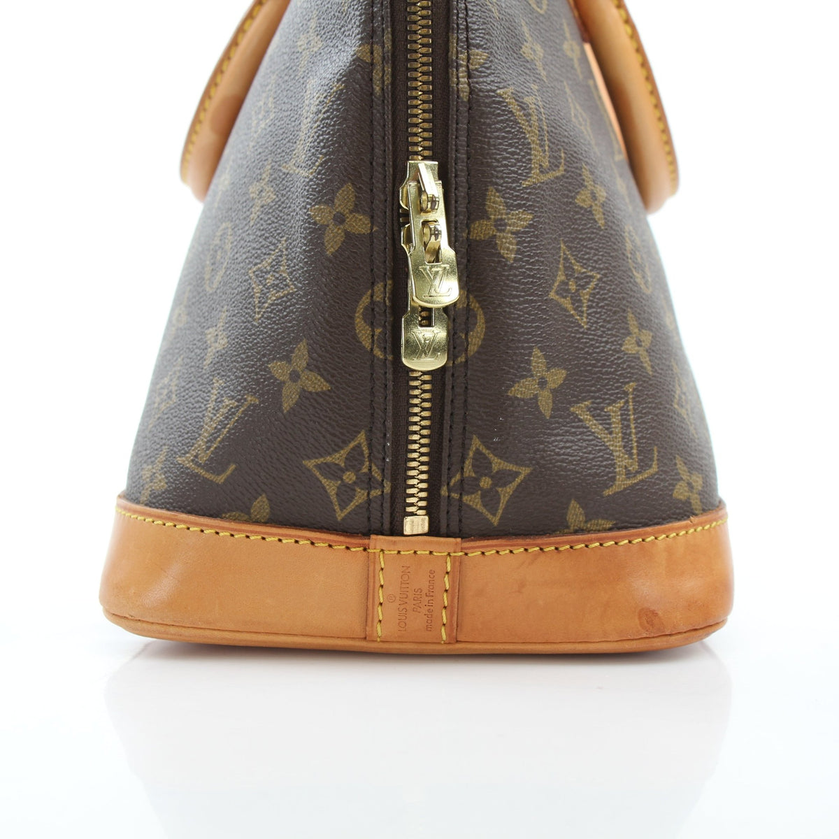 Louis Vuitton Monogram Alma PM handbag in brown coated canvas, featuring gold hardware and structured design.