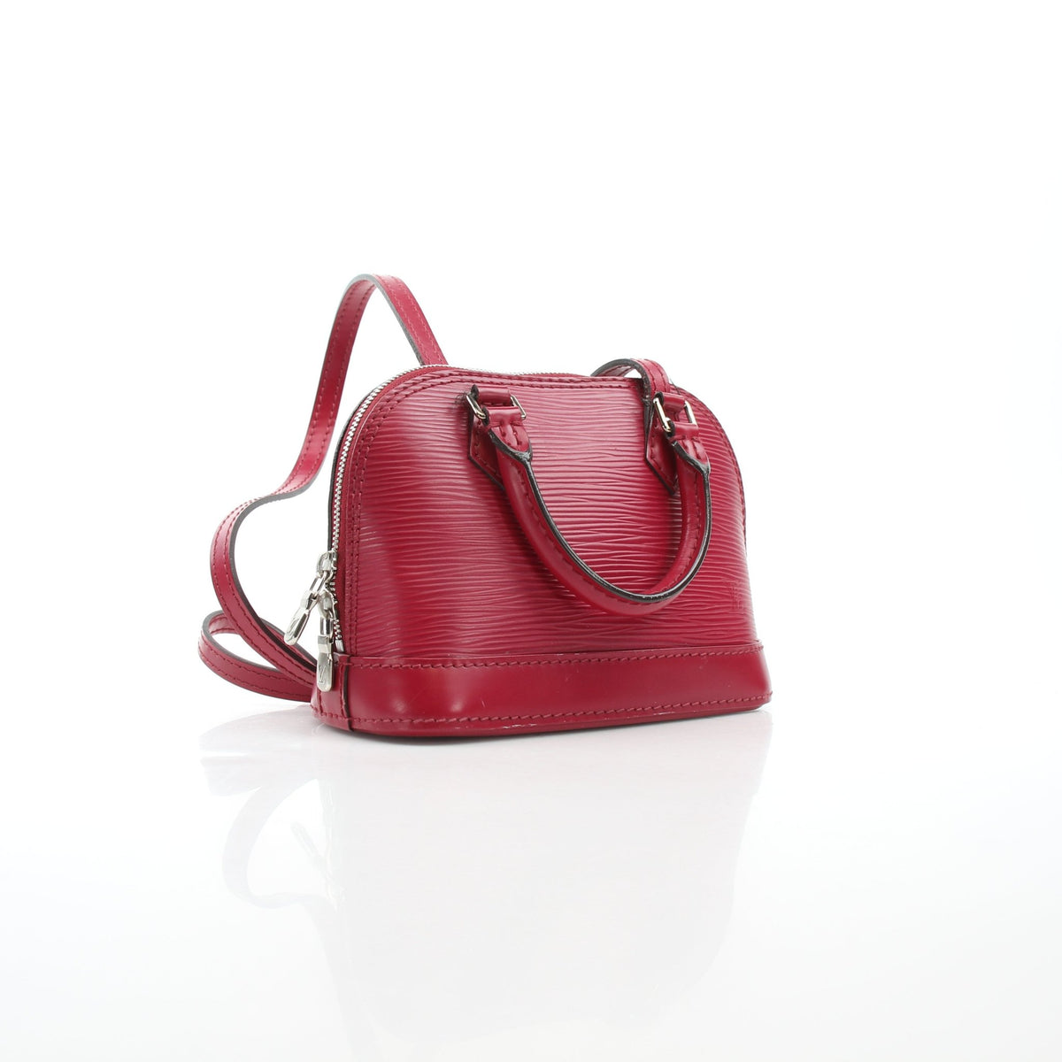 Red Louis Vuitton Epi Nano Alma leather handbag with gold hardware, detailed view of the compact, structured purse.