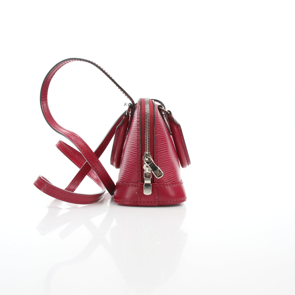 Louis Vuitton Epi Nano Alma red leather handbag with gold hardware, featuring a structured design and top handle.