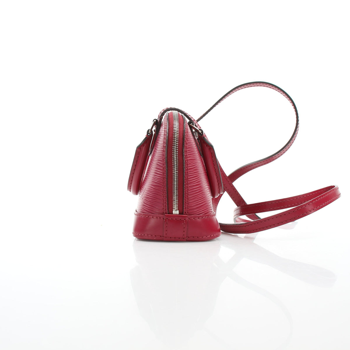 Louis Vuitton Epi Nano Alma red leather handbag with gold-tone hardware, featuring structured design and top handle.