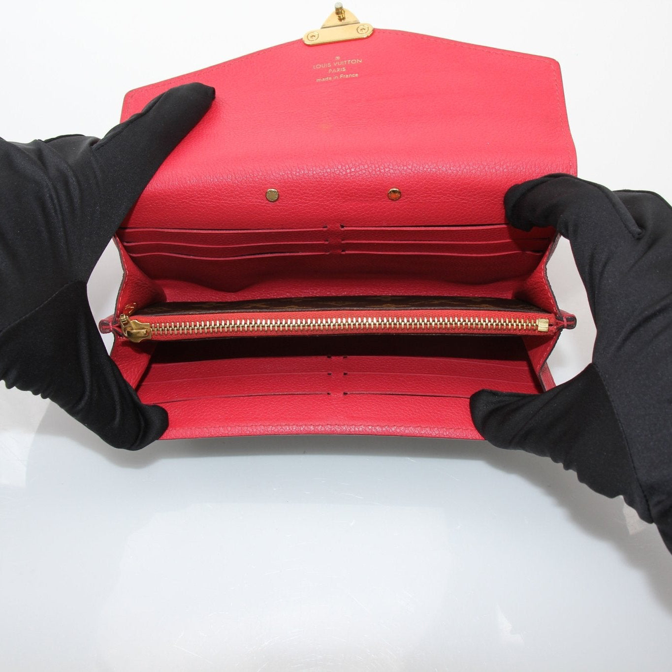 Louis Vuitton Pallas long wallet by Gold & Beyond, showing its elegant leather exterior and multiple card compartments.