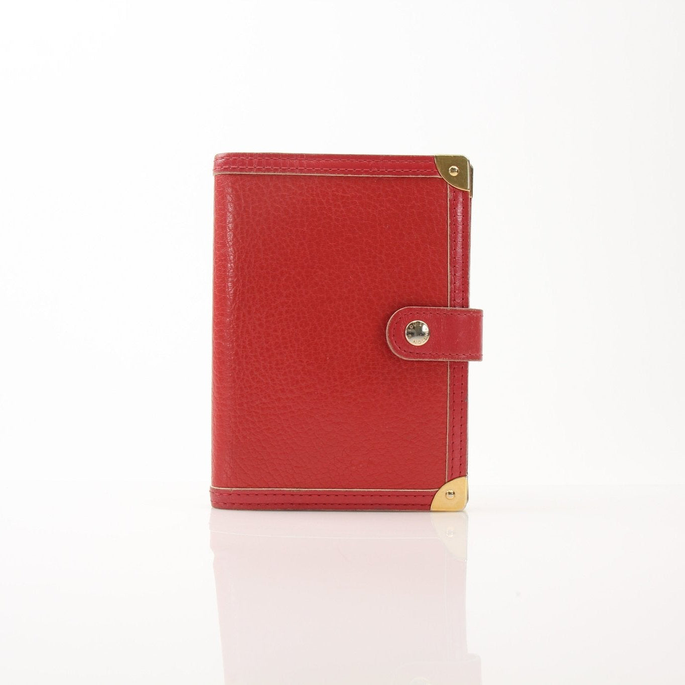 Louis Vuitton Suhali Le Fabuleux Red Agenda PM compact planner cover with gold hardware, showcasing luxurious leather accessories.