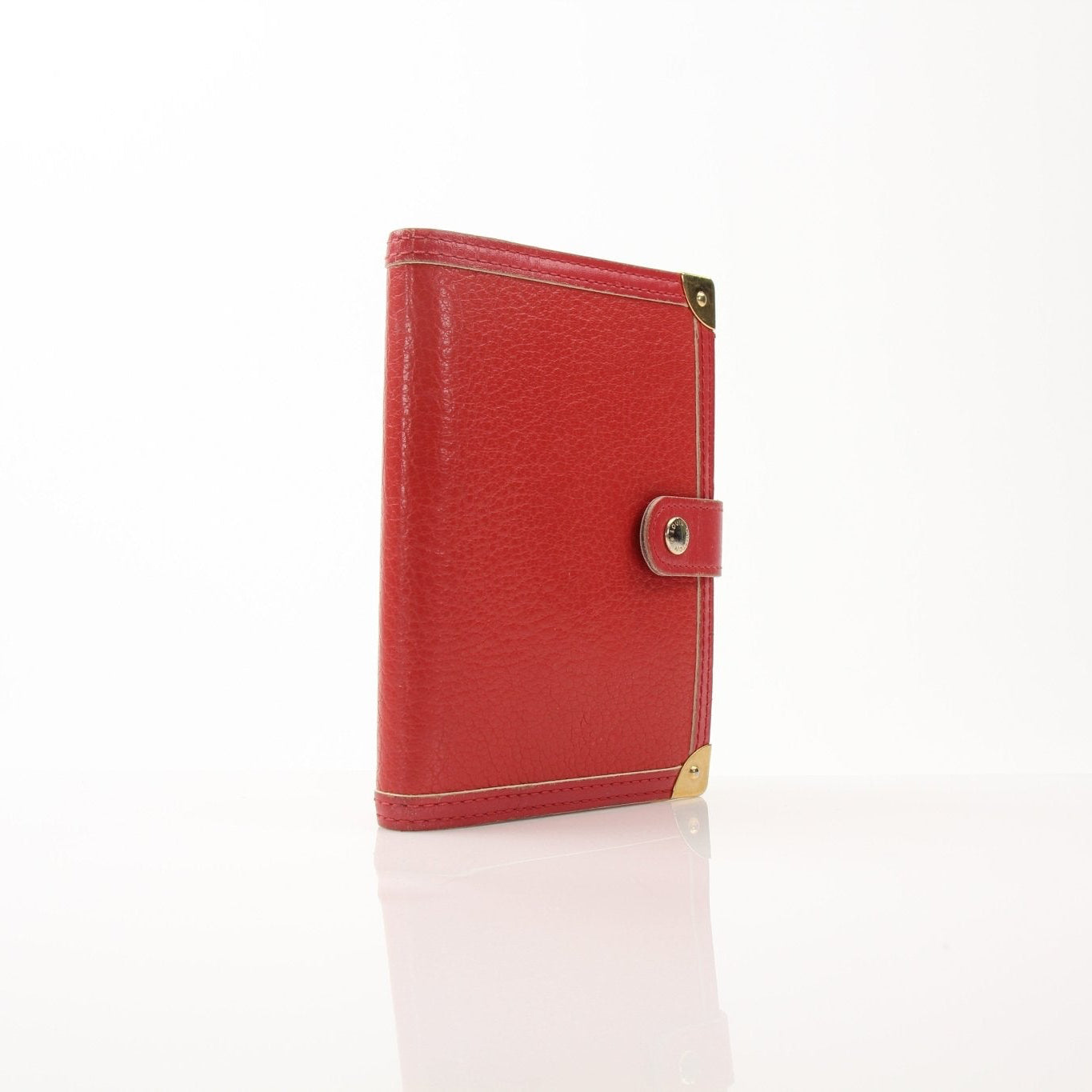 Louis Vuitton Suhali Le Fabuleux Red Agenda PM compact planner cover with gold accents and textured leather, designed for accessories.