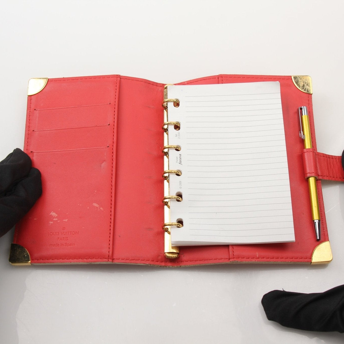 Louis Vuitton Suhali Le Fabuleux red agenda PM compact planner cover for accessories, featuring gold accents and detailed craftsmanship.