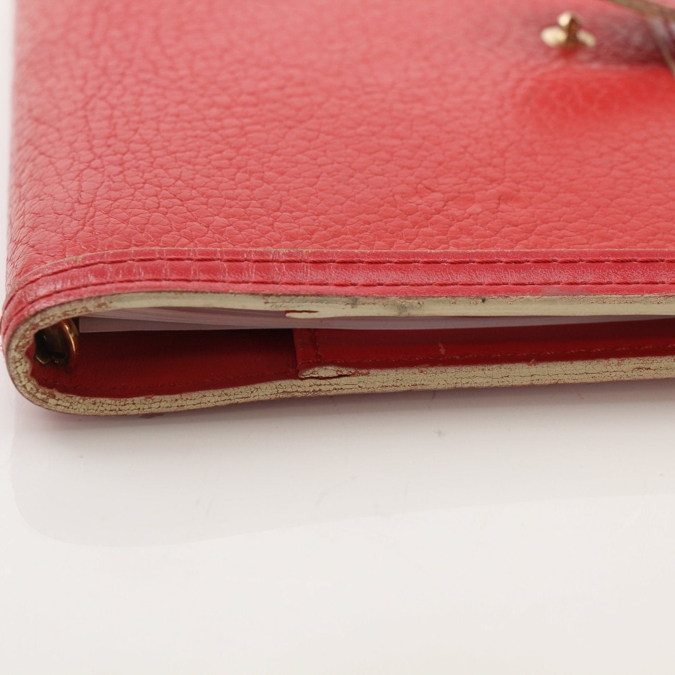 Louis Vuitton Suhali Le Fabuleux Red Agenda PM compact planner cover with gold hardware and textured leather, accessories for organization.