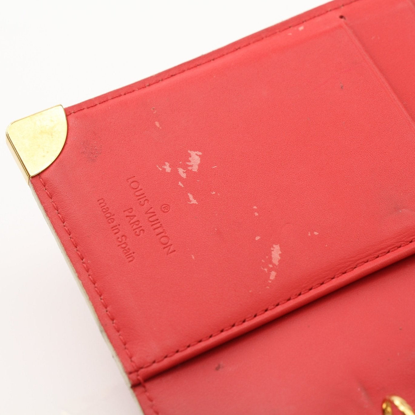 Louis Vuitton Suhali Le Fabuleux red agenda PM compact planner cover accessory with gold accents and detailed craftsmanship.