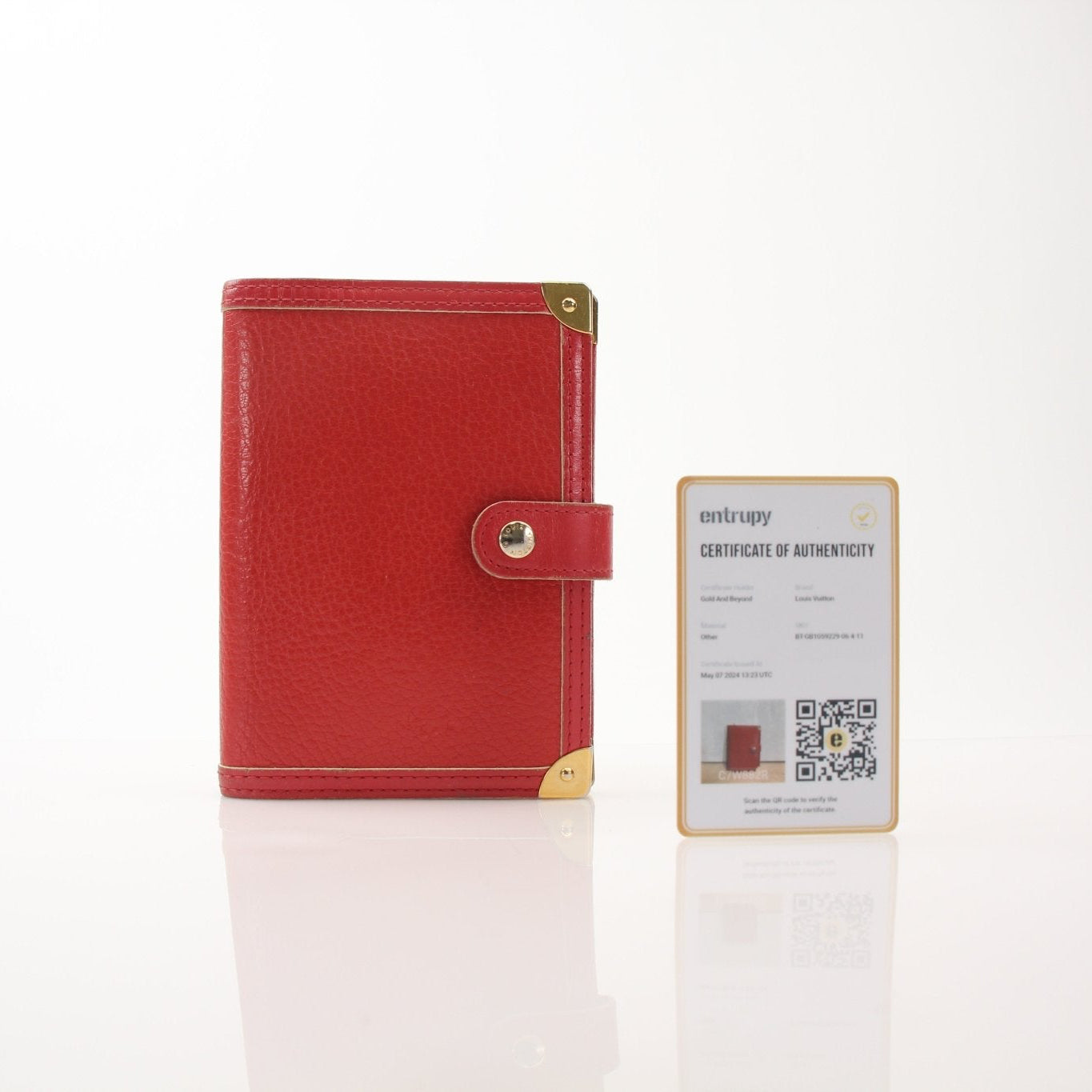Louis Vuitton Suhali Le Fabuleux Red Agenda PM compact planner cover with gold accents, designed for accessories and organization.