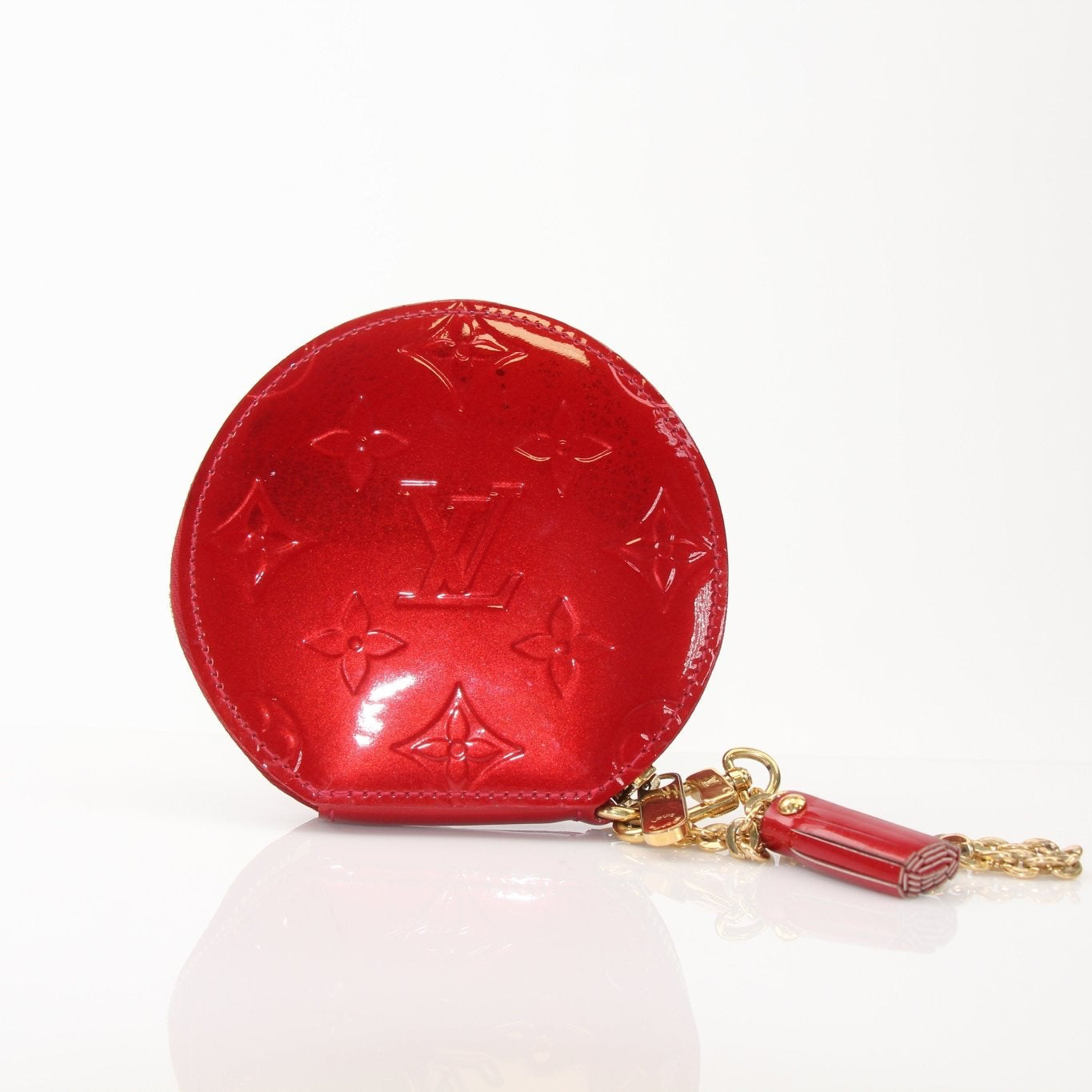 Louis Vuitton limited edition Bell Boy coin purse wallet with gold accents, designed by Gold & Beyond, showcasing intricate craftsmanship.