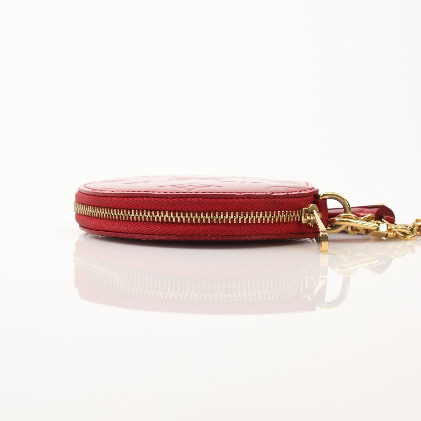 Louis Vuitton Limited Edition Bell Boy coin purse wallet with gold accents, featuring detailed design and compact size.