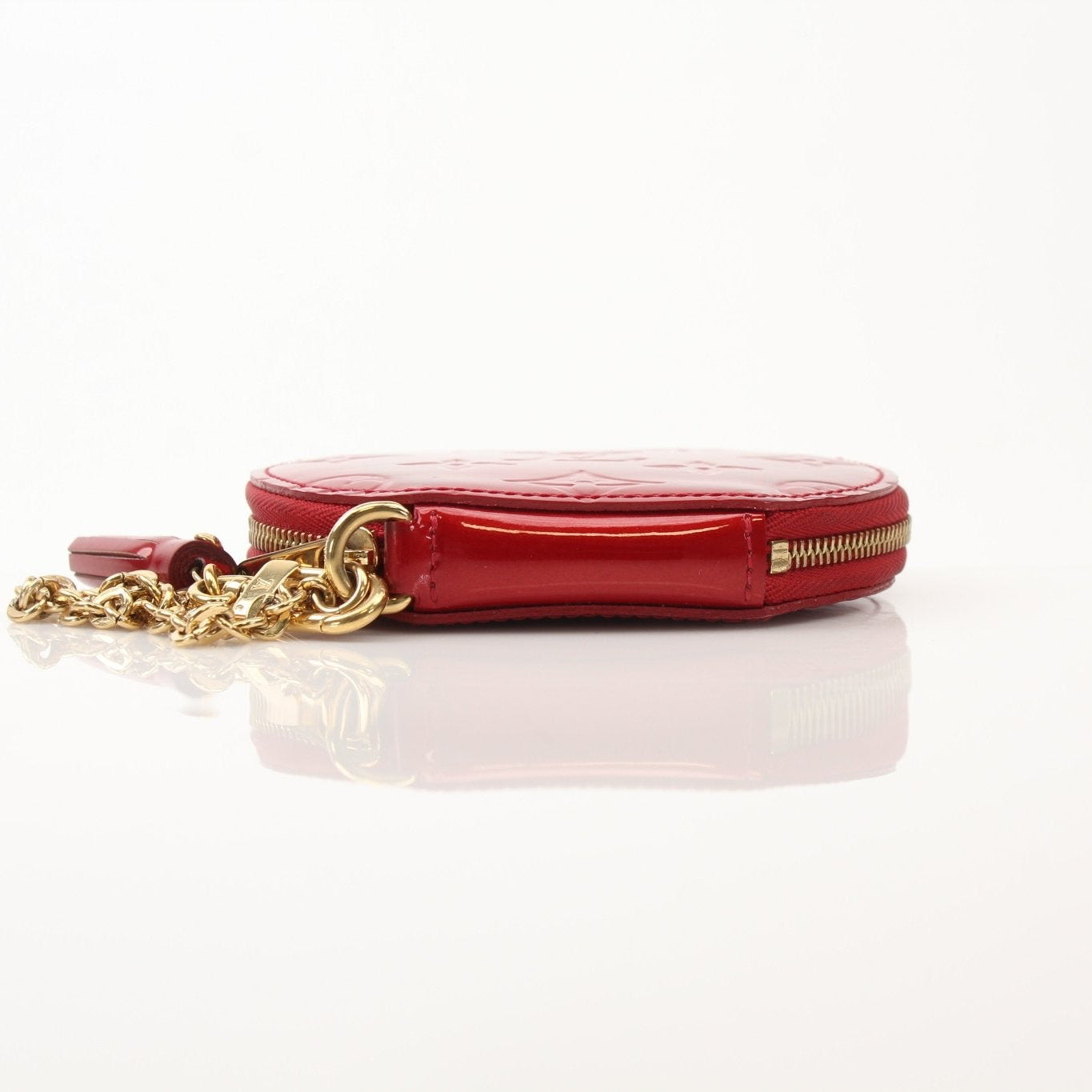 Louis Vuitton Limited Edition Bell Boy Coin Purse wallet with gold accents, featuring detailed craftsmanship and compact design.