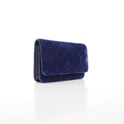 Chanel Classic Velvet Wallet on Chain in blue with gold hardware, featuring quilted velvet material and chain strap.