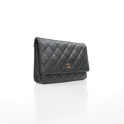 Chanel Classic Caviar Wallet on Chain handbag in black leather with gold-tone hardware, featuring a compact, elegant design.