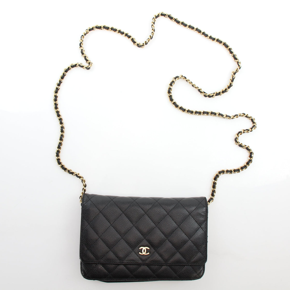 Chanel Classic Caviar Wallet on Chain handbag in black leather with gold hardware, featuring quilted design and chain strap.