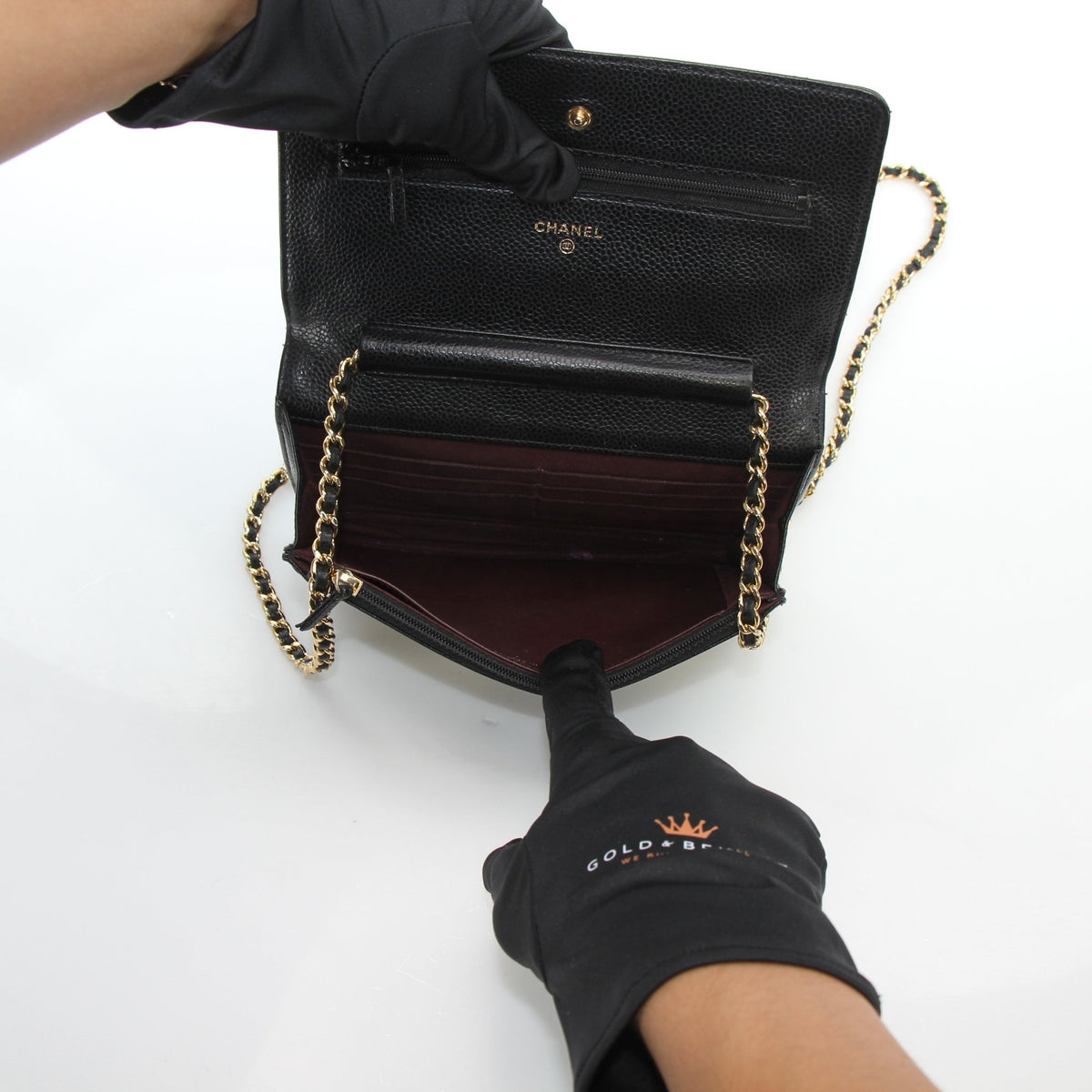 Chanel Classic Caviar Wallet on Chain handbag in black leather with gold-tone hardware, featuring signature quilted design.