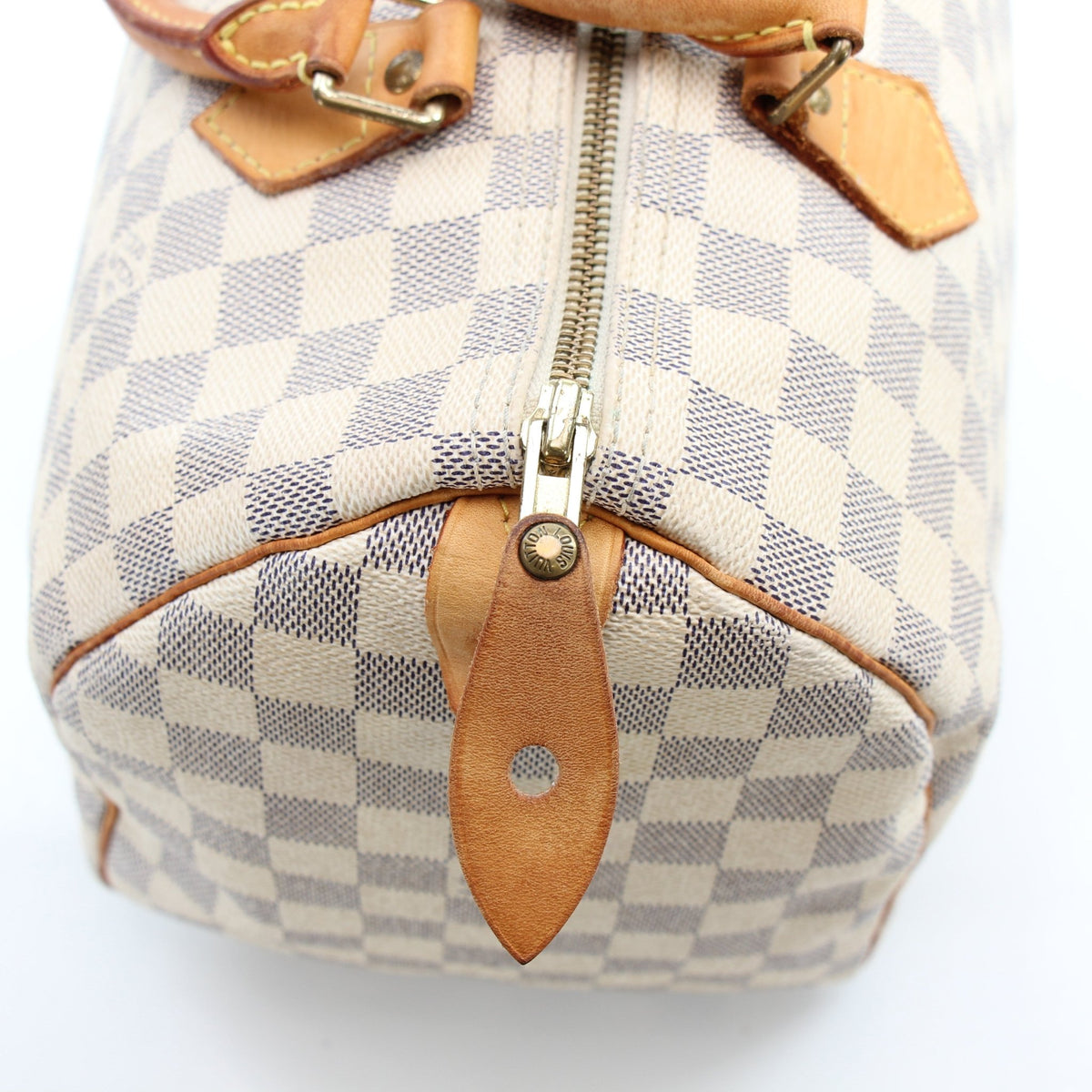 Louis Vuitton Damier Azur Speedy 30 handbag with leather handles and gold-tone hardware, featuring classic checkered pattern.