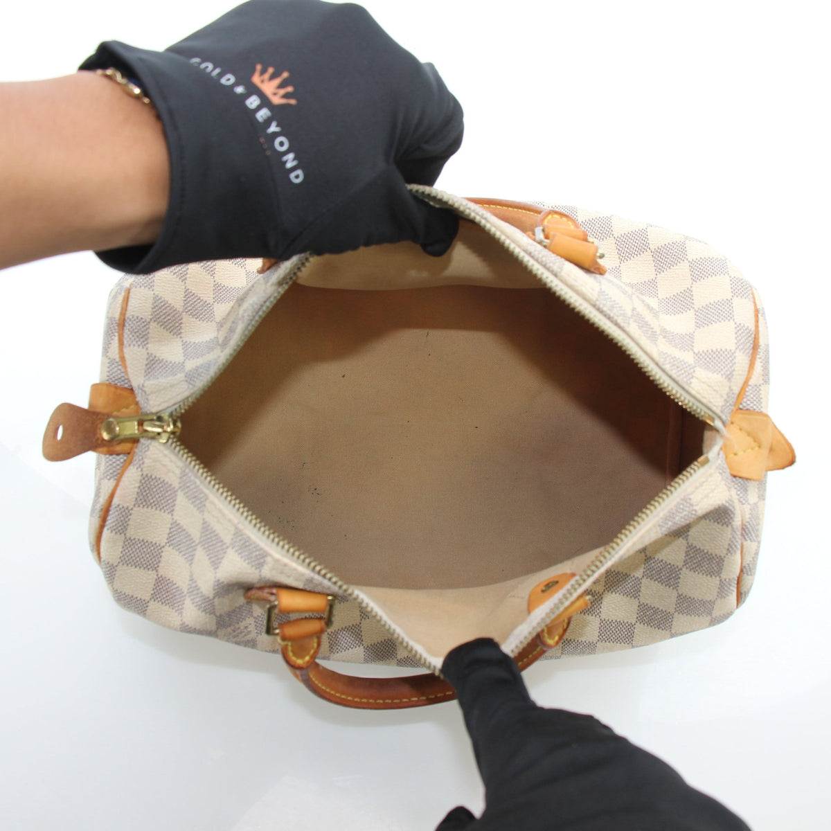 Louis Vuitton Damier Azur Speedy 30 handbag with leather handles and gold-tone hardware, featuring the signature checkered pattern.