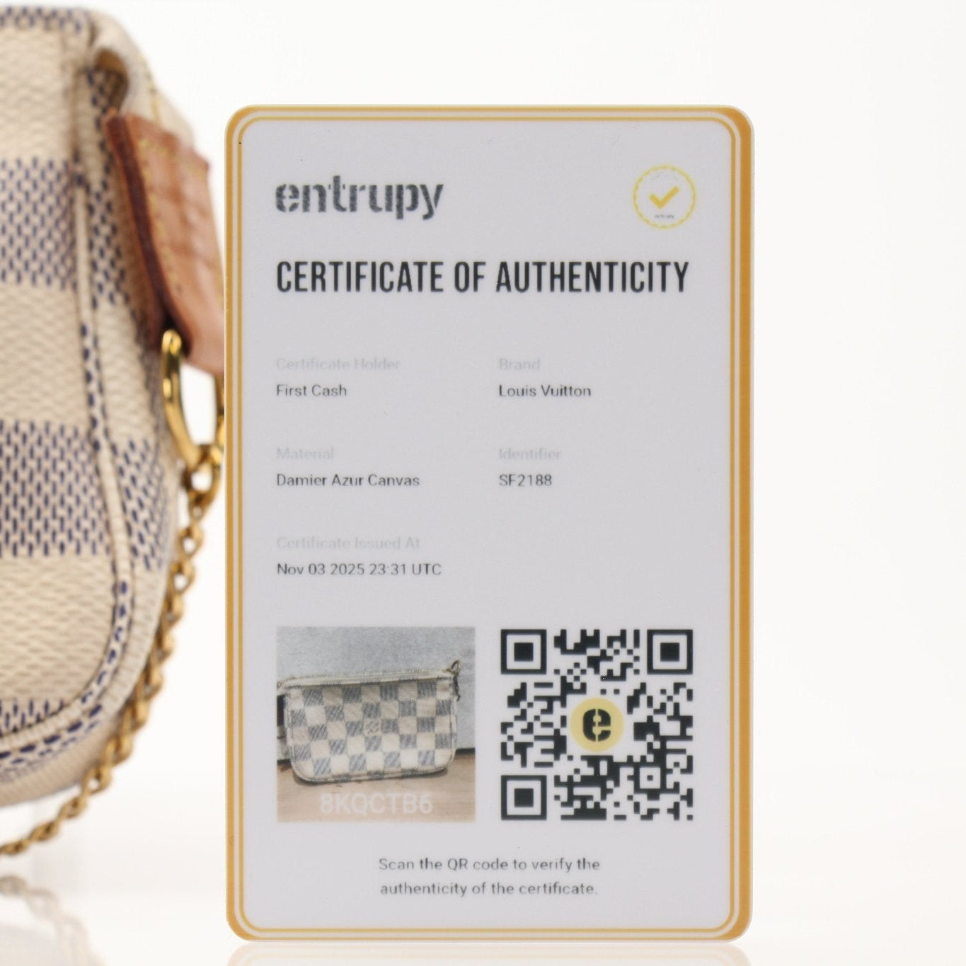 Louis Vuitton Pochette Chain Coin Purse handbag with gold chain and signature monogram design, carried by hand.