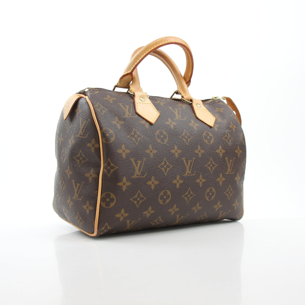 Louis Vuitton Monogram Speedy 25 handbag with leather handles and gold hardware, showcasing iconic monogram canvas and compact design.