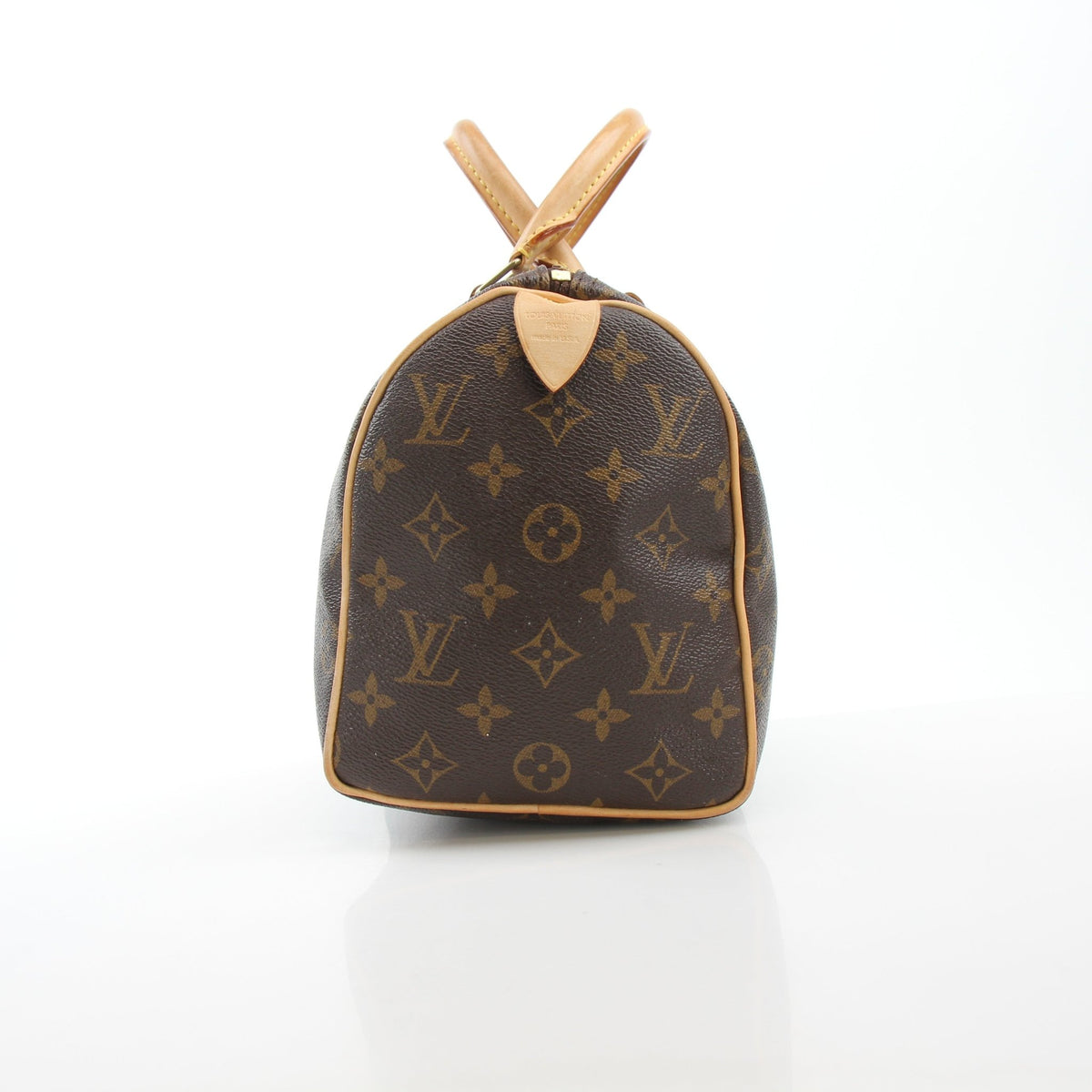 Louis Vuitton Monogram Speedy 25 handbag with leather handles and gold hardware, featuring signature monogram canvas.