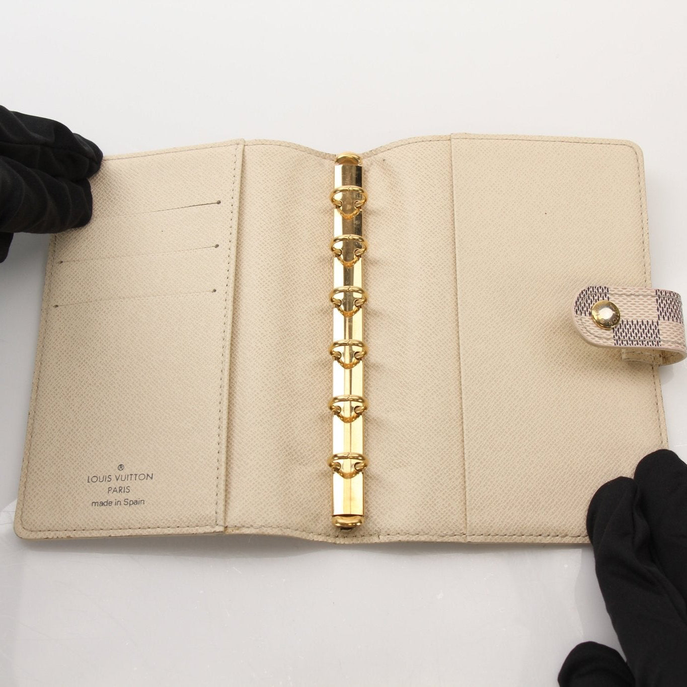Louis Vuitton Damier Azur Agenda PM in accessories, featuring the classic checkered pattern and gold accents on a leather cover.
