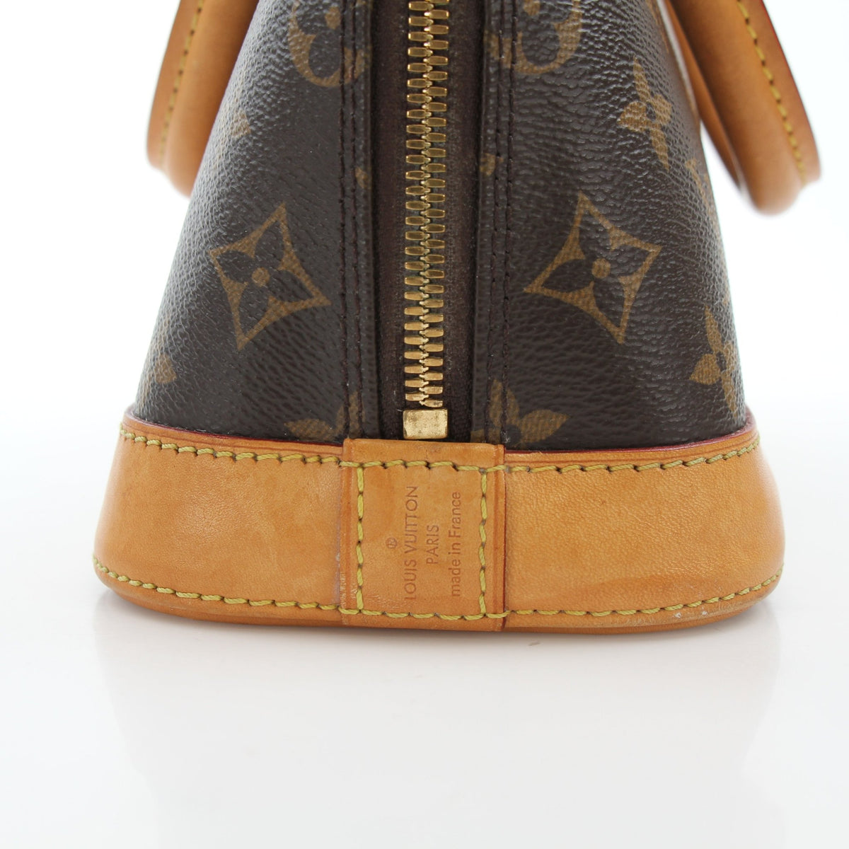 Louis Vuitton Brown Alma BB handbag with gold hardware, featuring structured design and top handles, on a plain background.