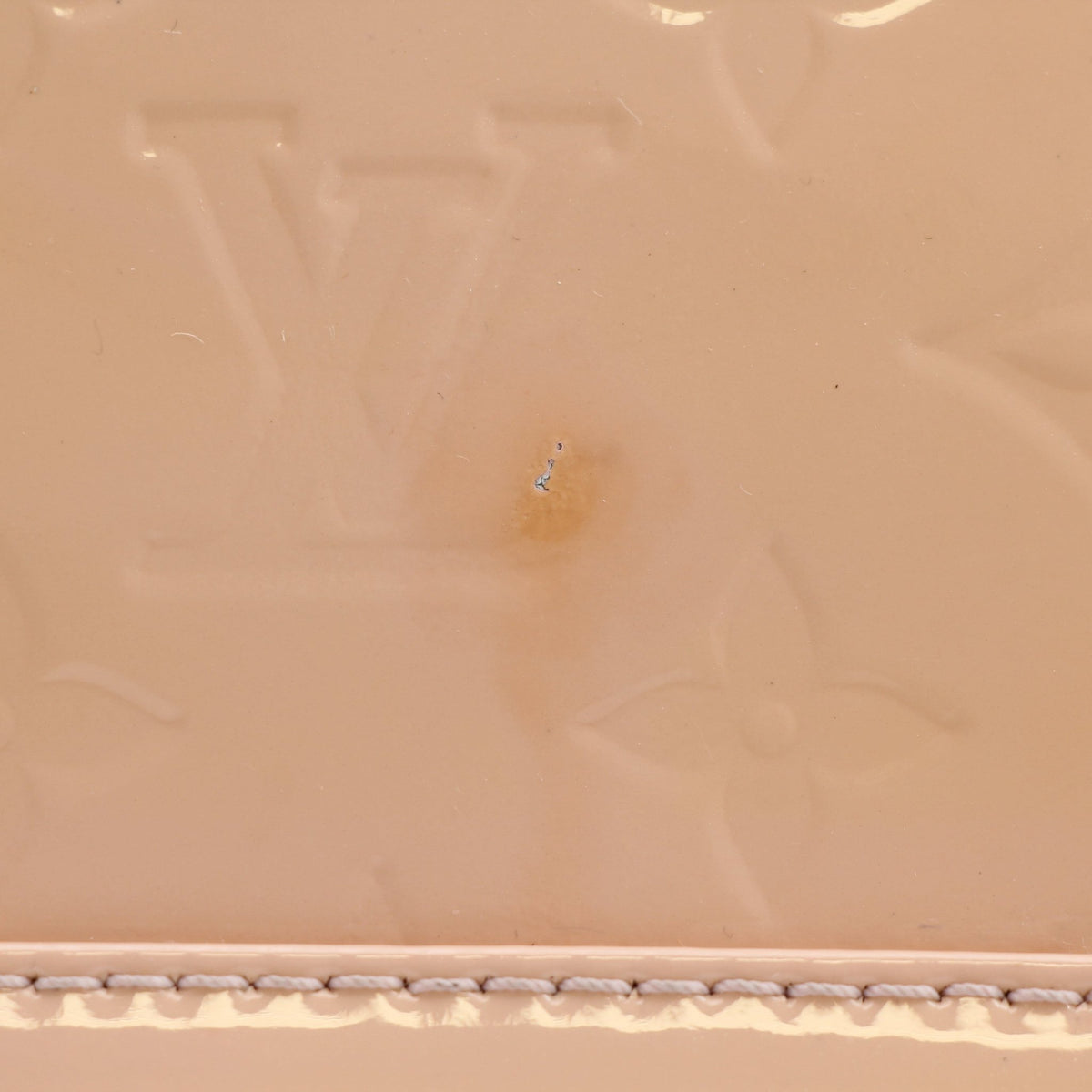 Louis Vuitton Blush Pink Alma BB handbag with gold hardware, featuring structured design and top handle, displayed on a plain background.