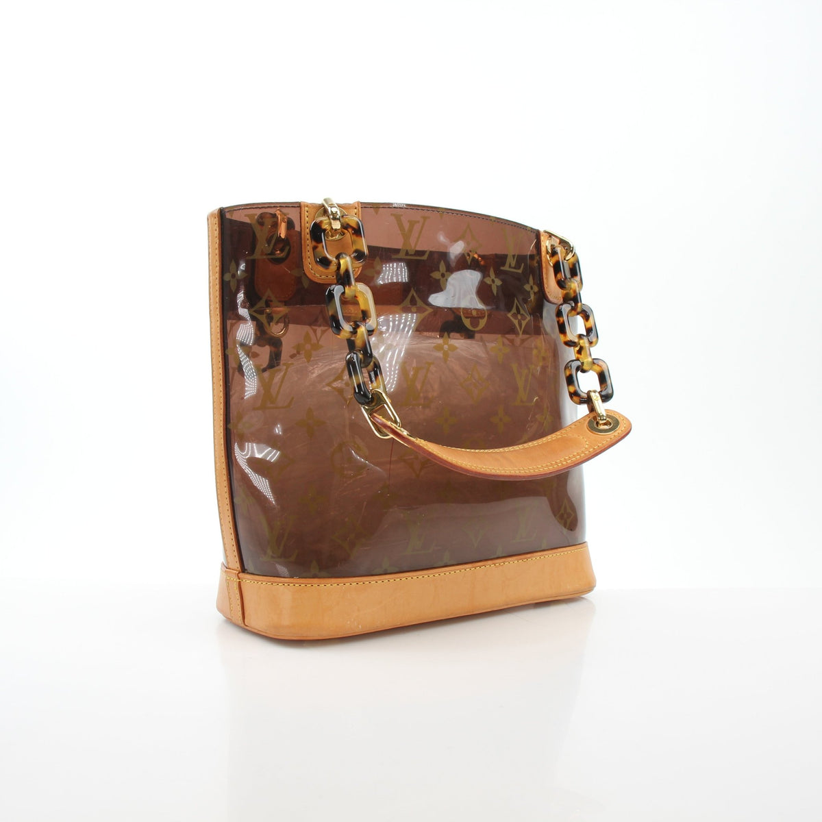 Louis Vuitton Cabas Ambre PM tote handbag in beige with natural leather handles and gold-tone hardware.
