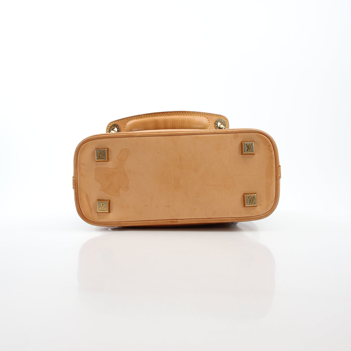 Louis Vuitton Cabas Ambre PM tote handbag with tan leather handles and spacious interior, displayed on a neutral background.