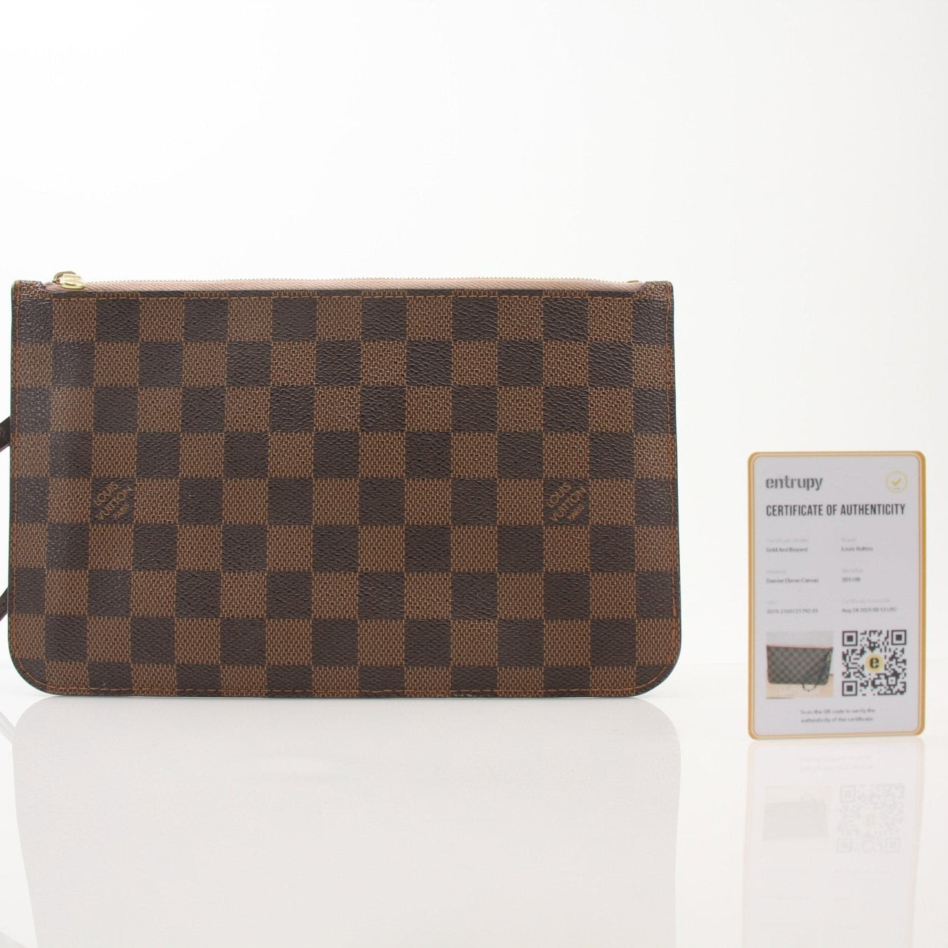 Gold & Beyond Louis Vuitton Pochette Wristlet, a stylish travel bag with a sleek design and wrist strap, suitable for everyday use.