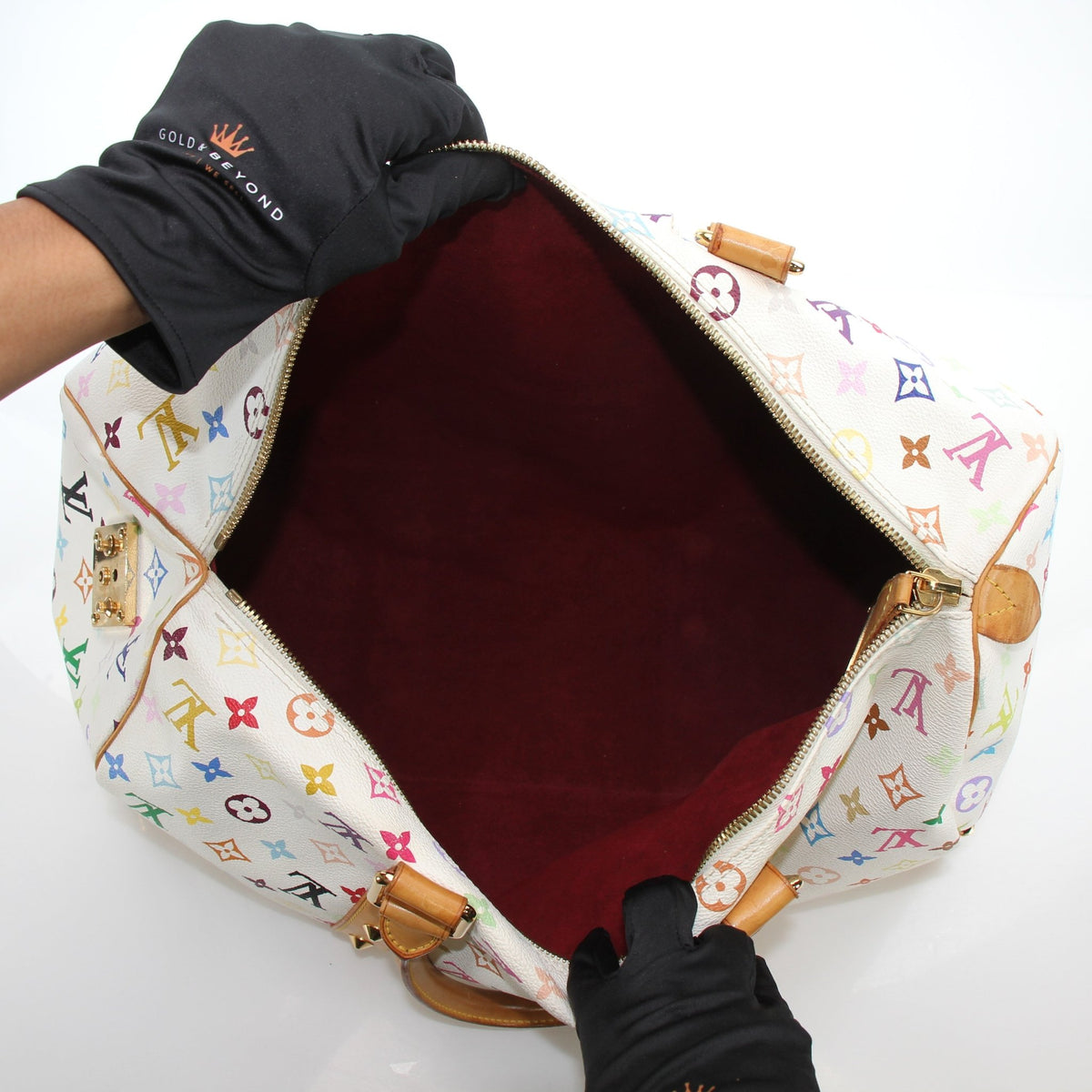 Louis Vuitton x Takashi Murakami Keepall 45 travel bag with colorful floral pattern and monogram canvas design.