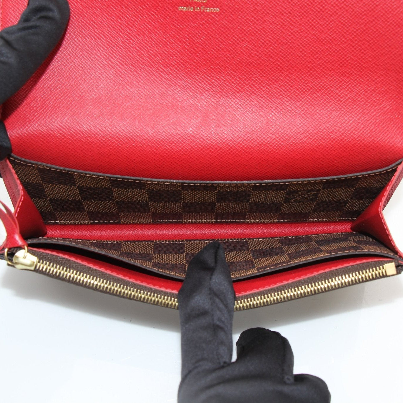 Gold & Beyond Louis Vuitton Emilie Wallet featuring luxurious leather with gold accents and multiple card slots.