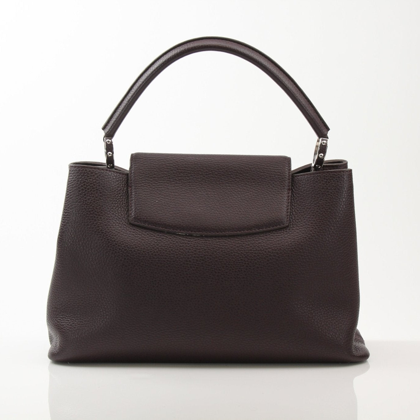 Louis Vuitton Capucines MM top handle handbag with leather and gold hardware, showcasing its elegant design and structured silhouette.