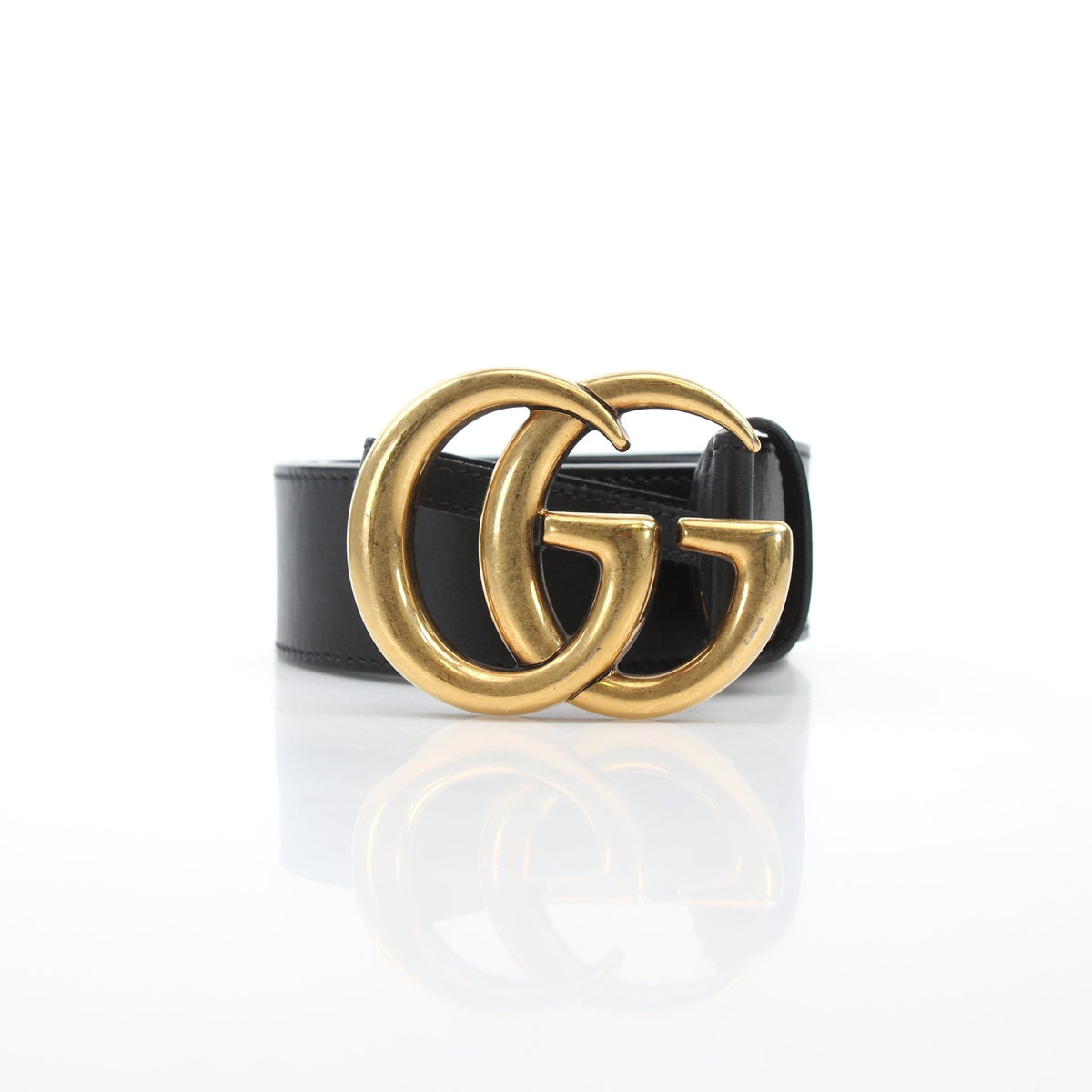 Black leather Gucci GG Marmont wide belt with gold buckle, stylish accessories for fashion-forward outfits.