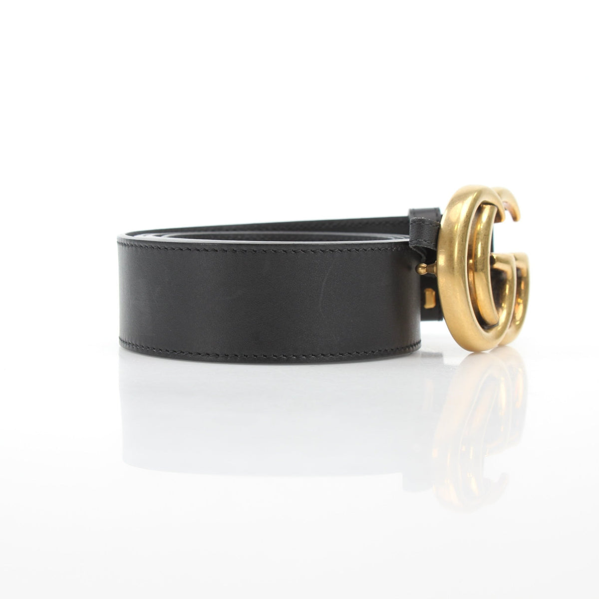 Black Gucci GG Marmont wide leather belt with gold-tone buckle, stylish accessory for various outfits.