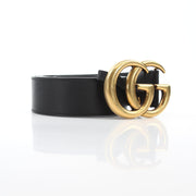 Black leather Gucci GG Marmont wide belt with gold-toned hardware, showcasing the signature GG logo buckle.