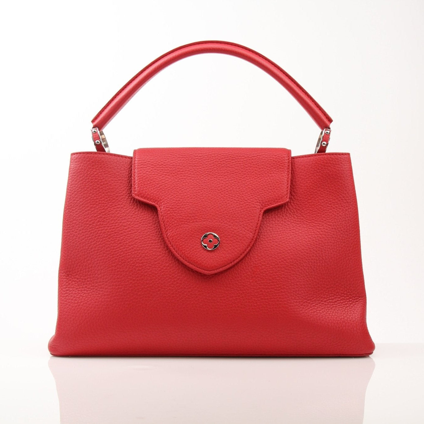 Gold & Beyond Louis Vuitton Capucines MM handbag with leather handles and signature monogram pattern.