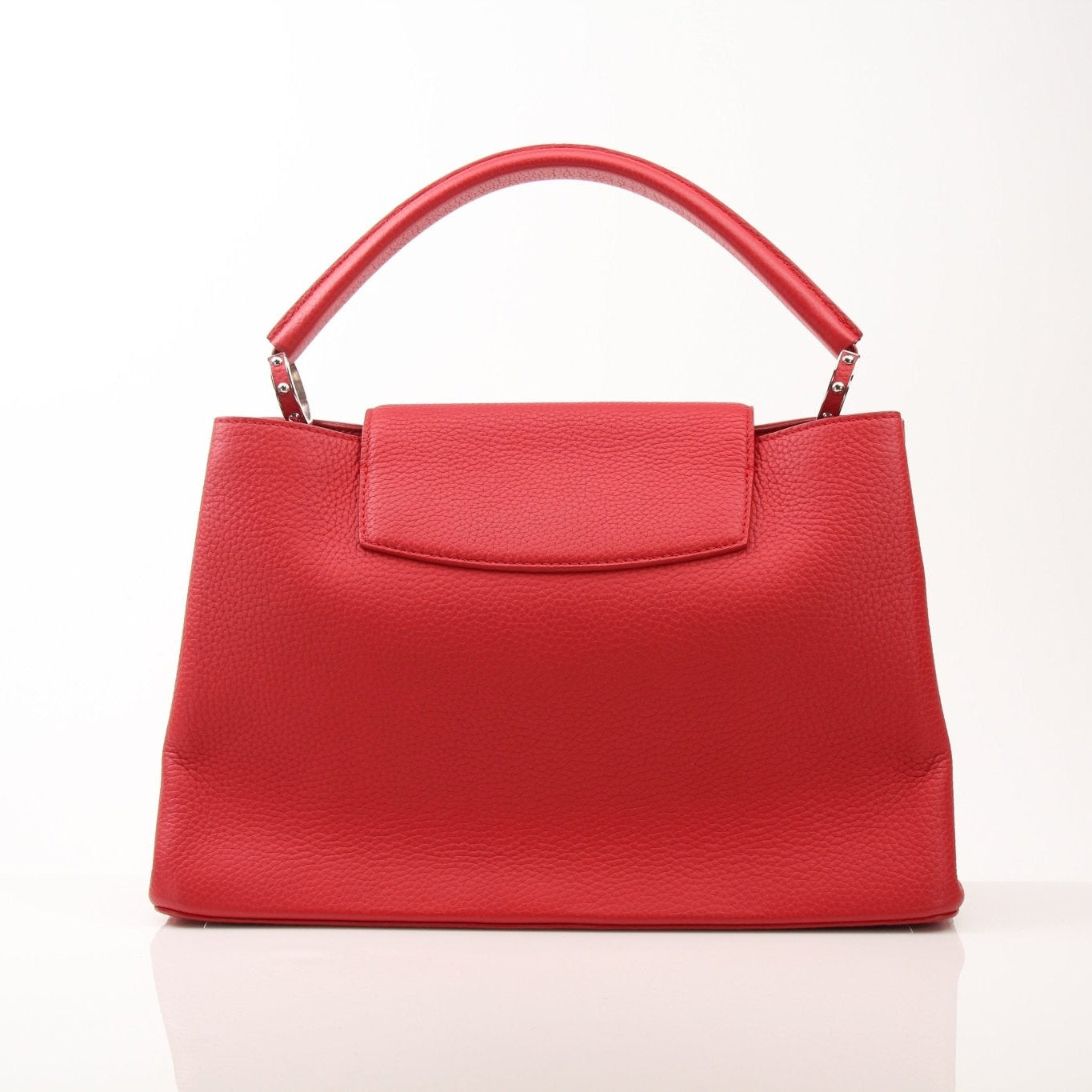 Louis Vuitton Capucines MM handbag with leather and gold-tone hardware, featuring structured design and top handles.