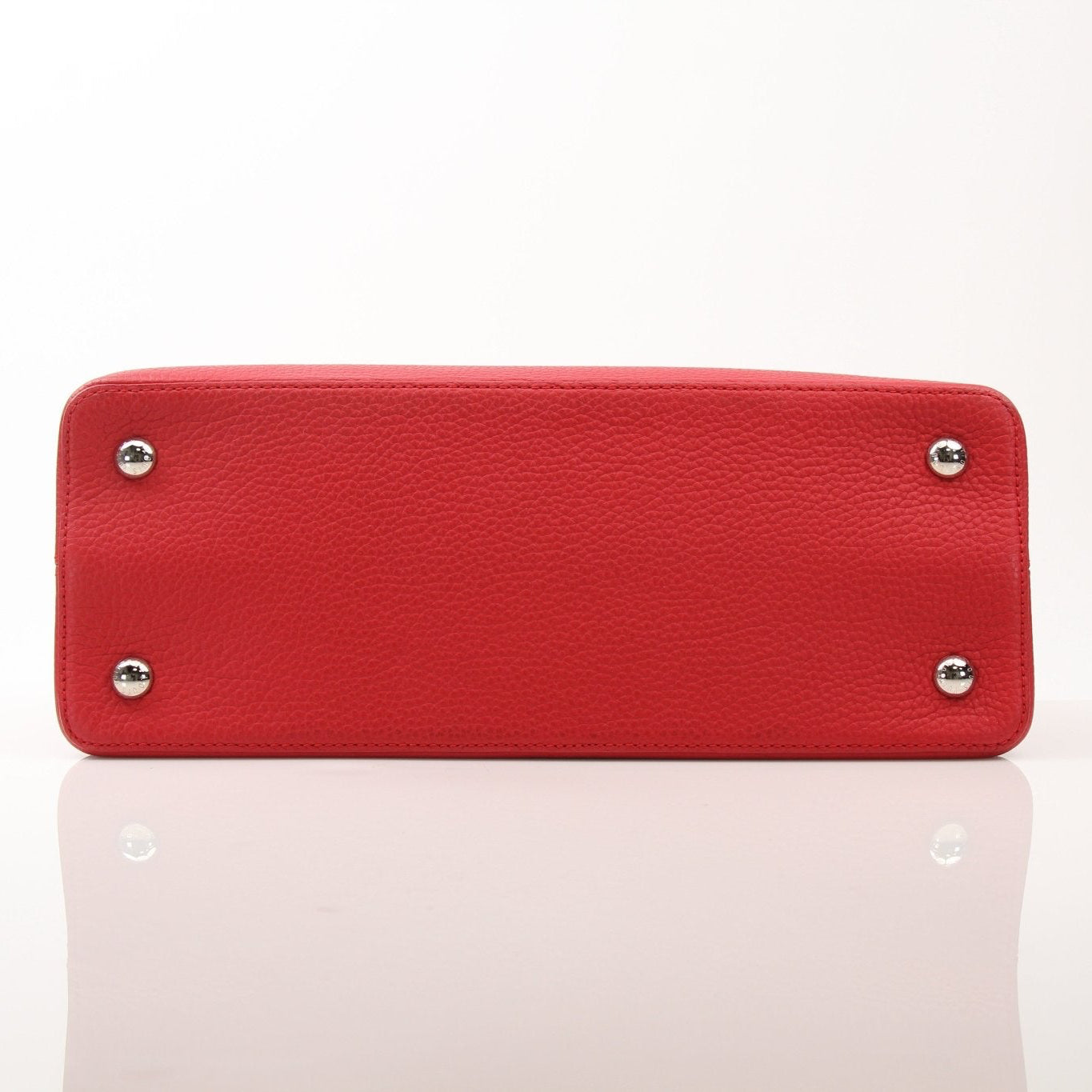 Louis Vuitton Capucines MM handbag with leather and gold hardware, featuring structured design and top handle.