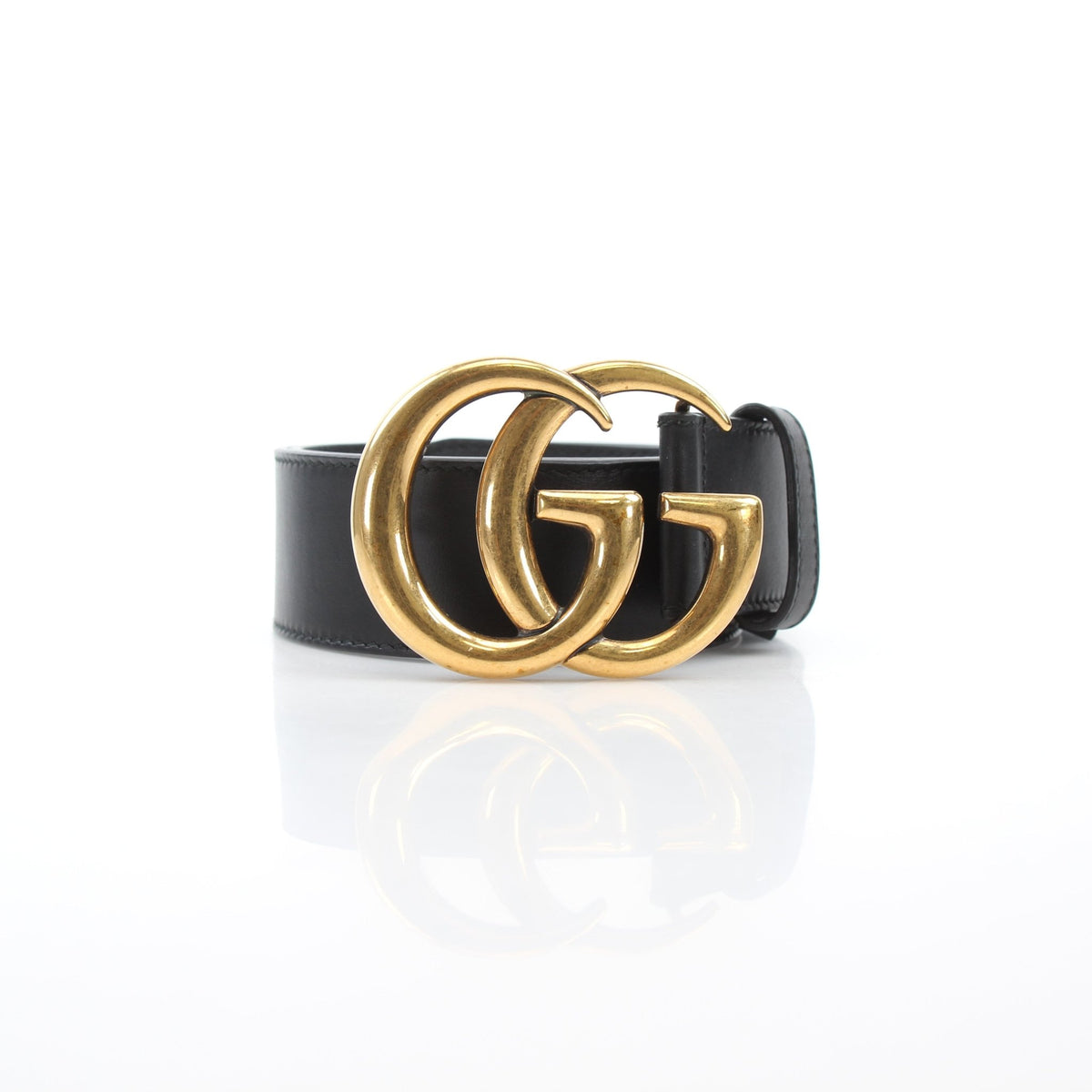 Black leather Gucci GG Marmont wide belt with gold-toned hardware and double G logo buckle, stylish accessory for versatile outfits.