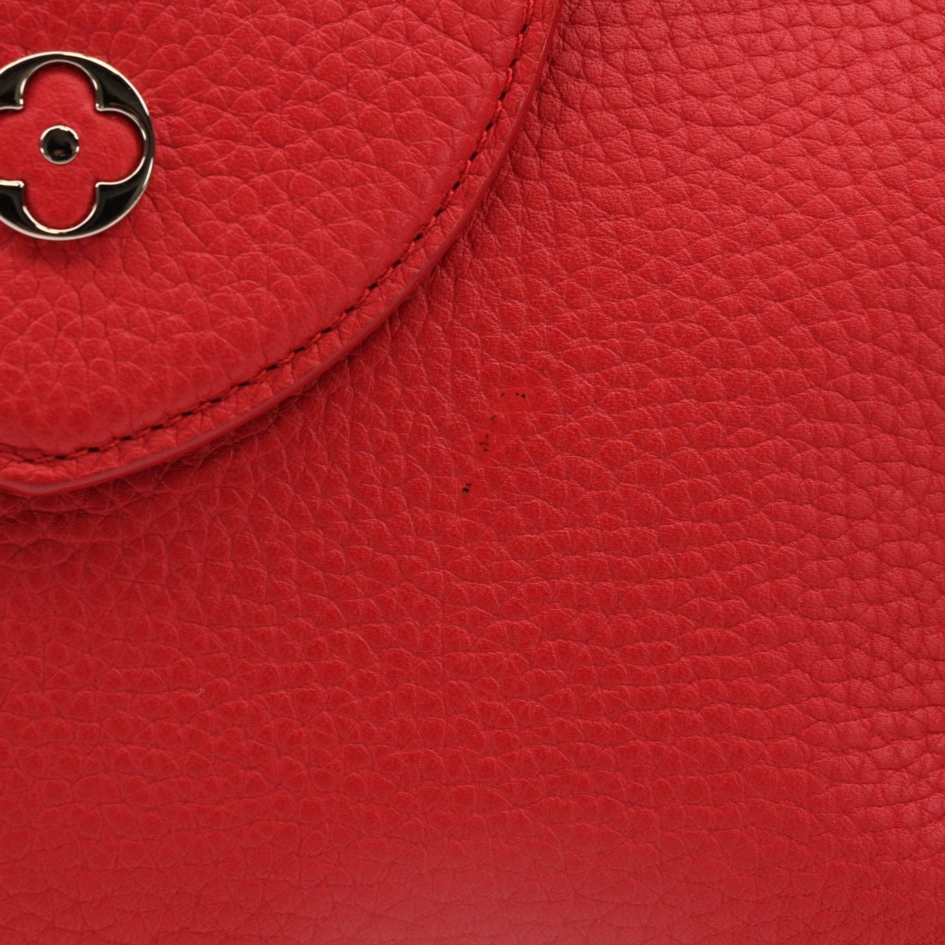 Gold & Beyond Louis Vuitton Capucines MM handbag with leather exterior and gold hardware, displayed on a neutral background.