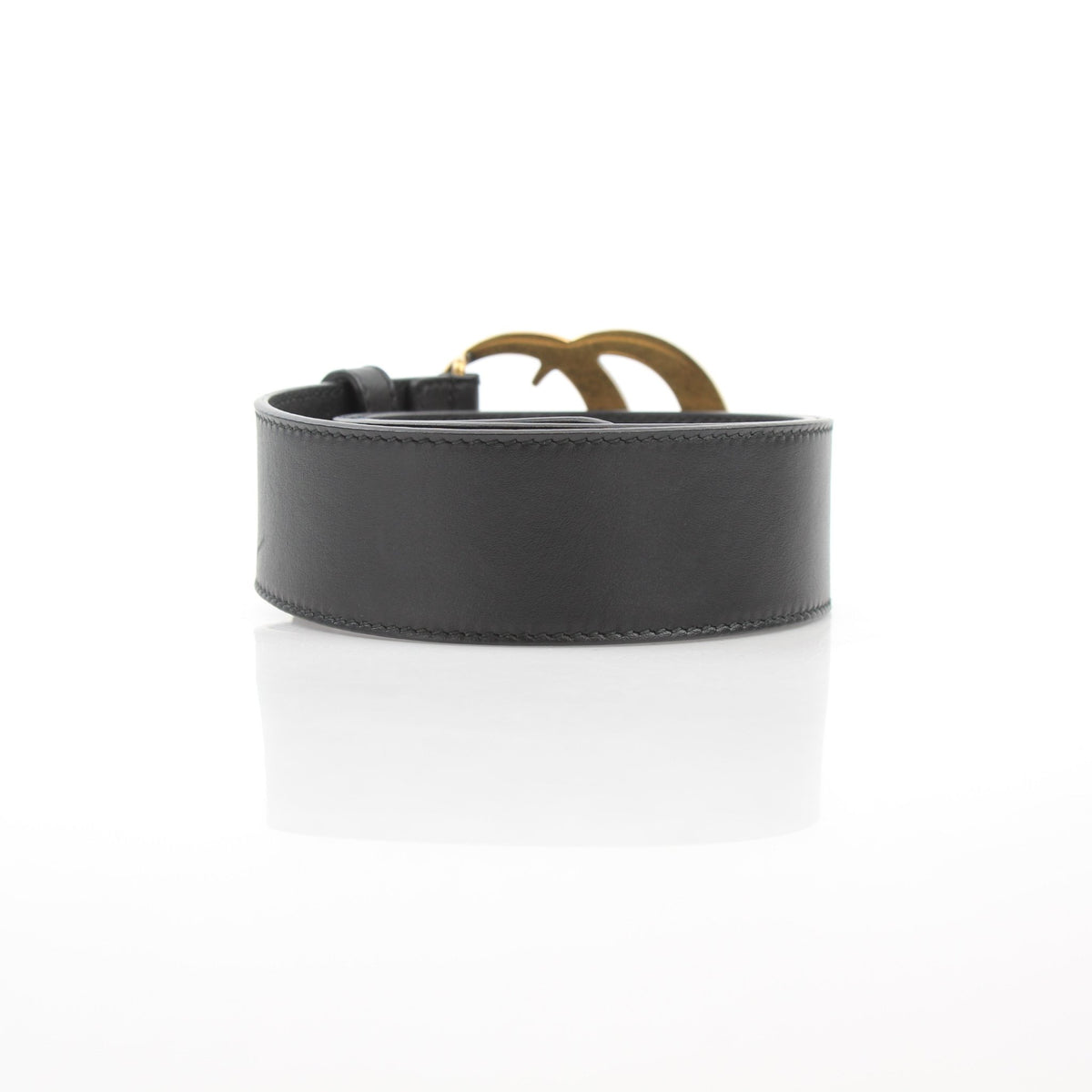 Black leather Gucci GG Marmont wide belt with gold hardware, featuring the signature double G logo.