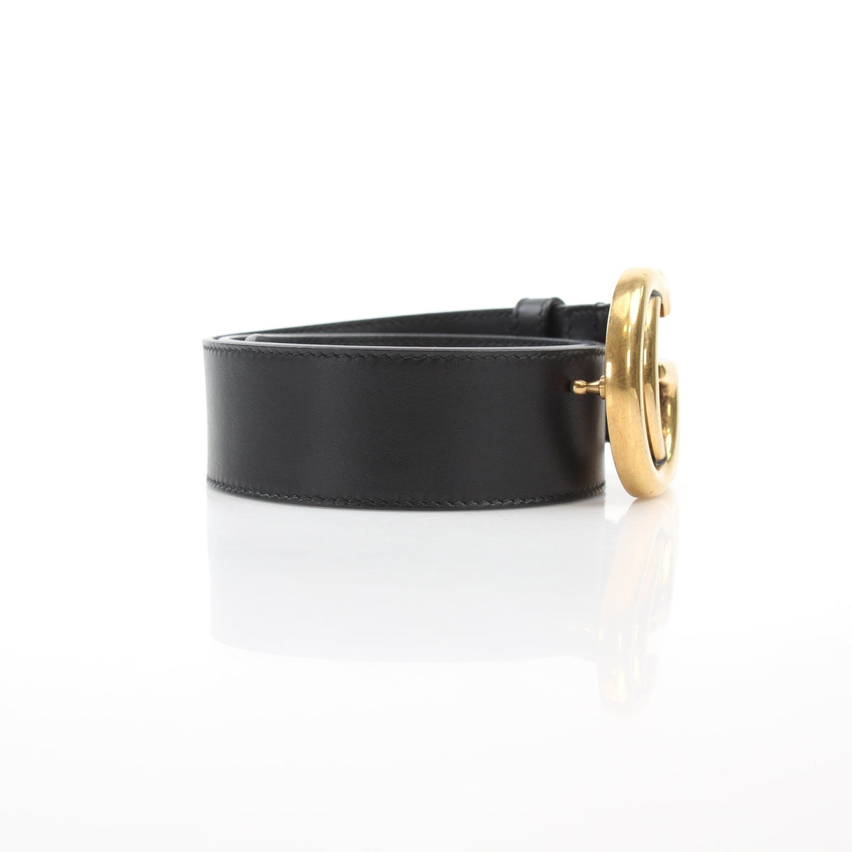 Black leather Gucci GG Marmont wide belt with gold hardware, stylish accessory for fashion-forward outfits.