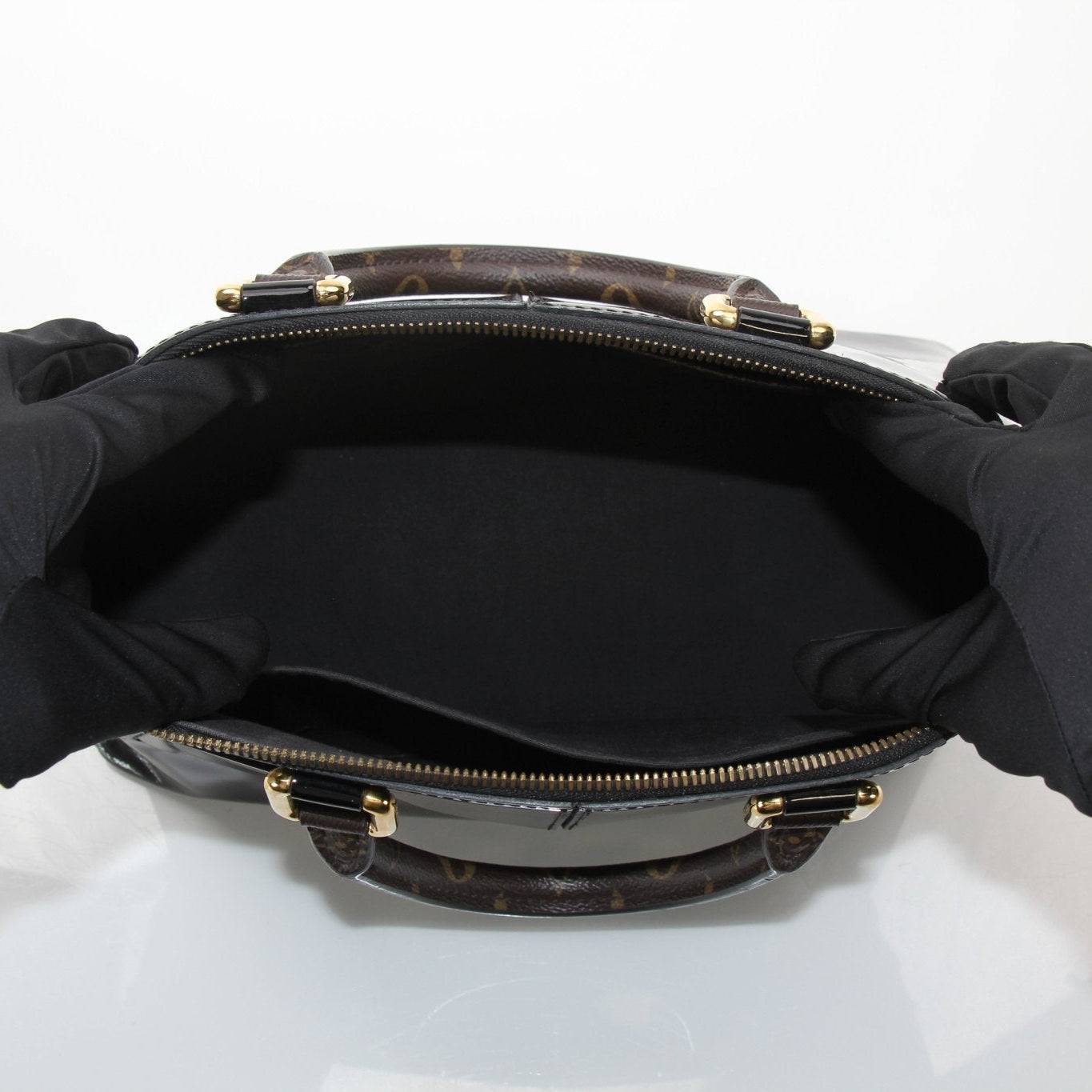Gold & Beyond Louis Vuitton Miroir Satchel Bag handbag with reflective metallic surface and structured design.