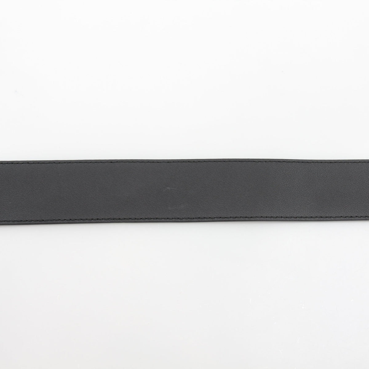 Black leather Gucci GG Marmont wide belt with gold hardware, featuring the signature GG logo and adjustable strap.