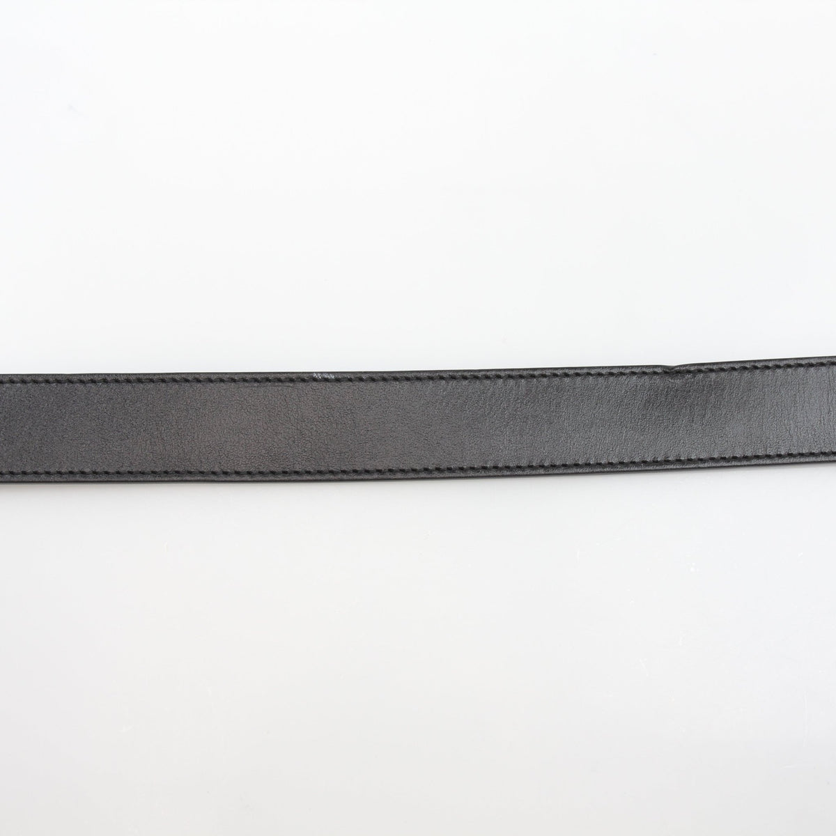 Black Gucci GG Marmont thin leather belt with gold-tone hardware, stylish accessories for women.