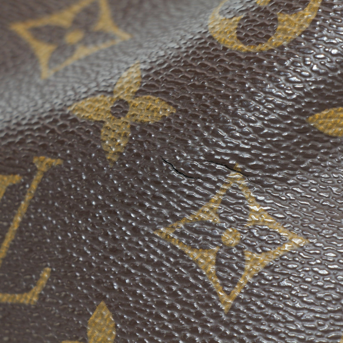 Louis Vuitton Sully MM monogram hobo shoulder bag with gold-tone hardware and leather accents, stylishly displayed on a neutral background.